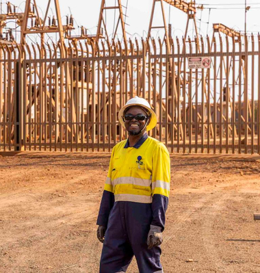 electrical worker stands in front of site