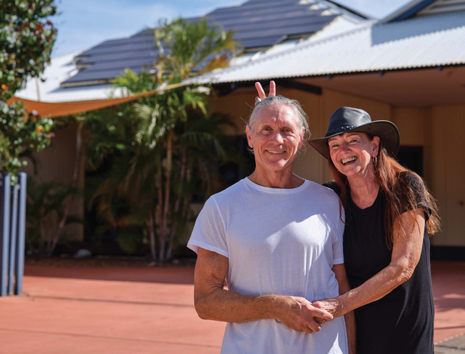 Regional WA couple smiling and waving